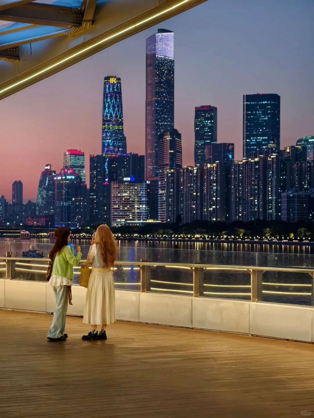 Guangzhou Zhujiang New Town skyline at dusk from the Pearl River